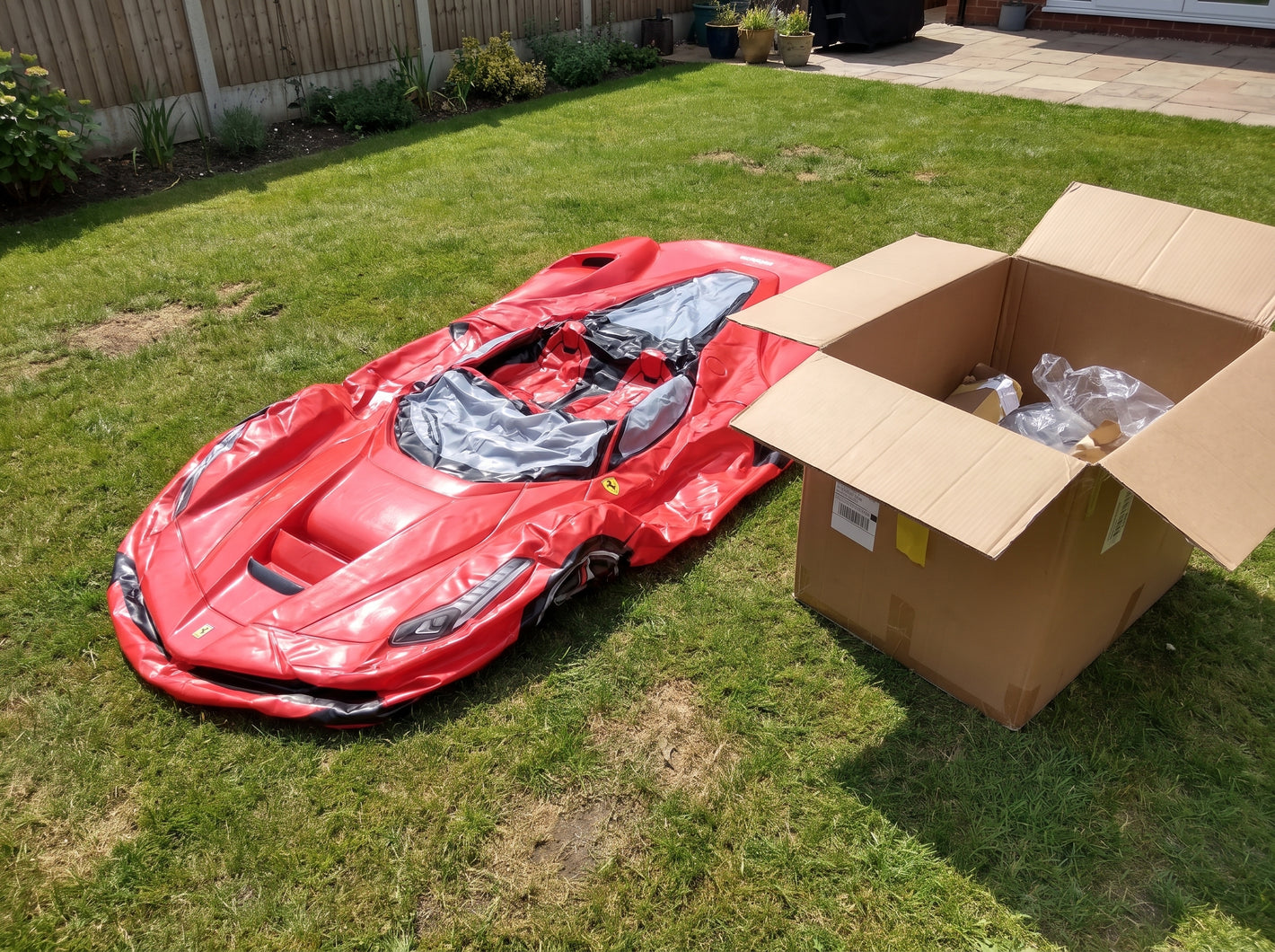 Customer photo - Ferrari car float in backyard